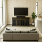 OnePaw Vesta living room with a gray sofa, wooden furniture crate stand, and television.