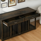 OnePaw Vesta wooden pet crate with drawers in a room with framed pictures on the wall.
