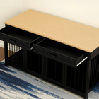 OnePaw Vesta black pet crate with wooden top on a blue and gray striped rug